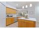 Updated kitchen with island, stainless steel appliances, and light wood cabinets at 13231 Snowy Plover Ave, Weeki Wachee, FL 34614
