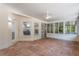 Bright sunroom with tile flooring and screened windows at 13231 Snowy Plover Ave, Weeki Wachee, FL 34614