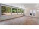 Bright sunroom with tile floor, large windows, and French doors at 13231 Snowy Plover Ave, Weeki Wachee, FL 34614