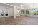 Spacious screened porch with tile flooring and ceiling fans at 13231 Snowy Plover Ave, Weeki Wachee, FL 34614
