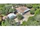 Aerial view showing house, detached garage, and large backyard at 13231 Snowy Plover Ave, Weeki Wachee, FL 34614