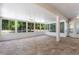 Large sunroom with tile flooring, multiple windows and fans at 13231 Snowy Plover Ave, Weeki Wachee, FL 34614