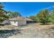 House exterior showcasing back and side views with screened porch at 13231 Snowy Plover Ave, Weeki Wachee, FL 34614