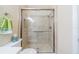 Bathroom featuring a spacious walk-in shower with glass enclosure at 2346 Nantucket Dr # 58, Sun City Center, FL 33573