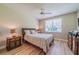 Bedroom with wood flooring, large window, and built-in dresser at 2346 Nantucket Dr # 58, Sun City Center, FL 33573