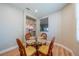 Small dining area with a glass table and four chairs at 2346 Nantucket Dr # 58, Sun City Center, FL 33573