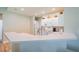 Kitchen features white cabinets, updated appliances, and a breakfast bar at 2346 Nantucket Dr # 58, Sun City Center, FL 33573