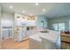 Spacious kitchen with white cabinets and a breakfast bar at 2346 Nantucket Dr # 58, Sun City Center, FL 33573