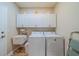 Laundry room with washer, dryer, cabinets, and utility sink at 2346 Nantucket Dr # 58, Sun City Center, FL 33573
