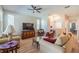 Bright living room with comfy seating, large TV, and hardwood floors at 2346 Nantucket Dr # 58, Sun City Center, FL 33573