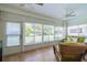 Sunroom featuring tiled floor, ceiling fan and view of the backyard at 2346 Nantucket Dr # 58, Sun City Center, FL 33573