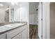 Bathroom featuring white cabinets, modern fixtures, and a walk-in shower at 6605 Pemberton Sage Ct, Seffner, FL 33584