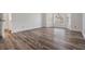 Bedroom with wood-look flooring, white walls, and a large window at 6605 Pemberton Sage Ct, Seffner, FL 33584