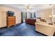 Cozy bedroom featuring a ceiling fan, plush carpeting, and natural light at 6605 Pemberton Sage Ct, Seffner, FL 33584