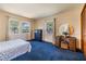 Well-lit bedroom featuring multiple windows and a vanity area at 6605 Pemberton Sage Ct, Seffner, FL 33584