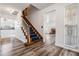 Bright entryway with hardwood floors and a staircase leading to the upper level at 6605 Pemberton Sage Ct, Seffner, FL 33584