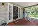 Inviting front porch with a rocking chair and an American flag-themed welcome mat at 6605 Pemberton Sage Ct, Seffner, FL 33584