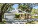 Charming two-story home with a well-manicured lawn, attached two-car garage, and inviting front porch at 6605 Pemberton Sage Ct, Seffner, FL 33584