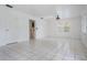 Bright living room features tile flooring, ample lighting and access to other areas at 6605 Pemberton Sage Ct, Seffner, FL 33584