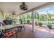 Covered, brick-floor porch includes outdoor seating and views of the property at 6605 Pemberton Sage Ct, Seffner, FL 33584