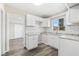 Modern kitchen with white shaker cabinets, granite countertops, and subway tile backsplash at 2504 38Th W Ave, Bradenton, FL 34205
