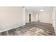 Living room with built-in shelves and wood-look floors at 2504 38Th W Ave, Bradenton, FL 34205