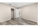 Simple bedroom with wood-look floors and a closet at 2504 38Th W Ave, Bradenton, FL 34205