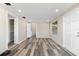 Spacious bedroom with wood-look floors and access to a full bathroom at 2504 38Th W Ave, Bradenton, FL 34205