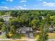 Aerial view of a single-Gathering home situated on a tree-lined street at 2504 38Th W Ave, Bradenton, FL 34205
