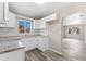 Modern kitchen with white shaker cabinets, granite countertops, and subway tile backsplash at 2504 38Th W Ave, Bradenton, FL 34205