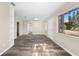 Bright living room featuring wood-look floors and built-in shelving at 2504 38Th W Ave, Bradenton, FL 34205