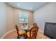 Bright dining room with glass table and wicker chairs at 2346 Nantucket Dr # 58, Sun City Center, FL 33573
