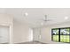 Spacious living room with vaulted ceiling and hardwood floors at 9171 Prospect Ave, Englewood, FL 34224