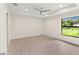Bright bedroom with large window and ceiling fan at 9171 Prospect Ave, Englewood, FL 34224
