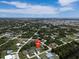 Aerial view of a single-Gathering home on a residential street, near the water at 9171 Prospect Ave, Englewood, FL 34224