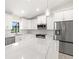 Modern kitchen with white cabinets and marble countertops at 9171 Prospect Ave, Englewood, FL 34224