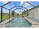 Screened-in pool with a modern design and ample deck space at 9171 Prospect Ave, Englewood, FL 34224