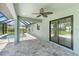 Relaxing pool area with covered patio and sliding glass doors at 9171 Prospect Ave, Englewood, FL 34224