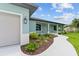 Front view of the house with a walkway and landscaping at 9171 Prospect Ave, Englewood, FL 34224