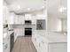 Modern kitchen with white cabinets and large island at 9171 Prospect Ave, Englewood, FL 34224