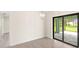 Bright dining room with sliding glass doors leading to a screened patio at 9171 Prospect Ave, Englewood, FL 34224