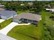 Single-Gathering home with a large front yard and driveway at 9171 Prospect Ave, Englewood, FL 34224