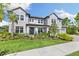 Stately two-story home with well-maintained lawn and landscaping offering great curb appeal at 7135 Graybrook Dr, Wesley Chapel, FL 33545