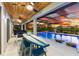 Lush patio area with a pool, outdoor seating, and a sunset view at 7135 Graybrook Dr, Wesley Chapel, FL 33545