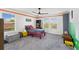 Charming bedroom with built-in shelving and colorful decor at 7135 Graybrook Dr, Wesley Chapel, FL 33545