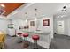 Wet bar with granite countertop and red barstools at 7135 Graybrook Dr, Wesley Chapel, FL 33545