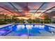 Inviting swimming pool with a spa and a screened enclosure at 7135 Graybrook Dr, Wesley Chapel, FL 33545