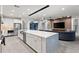 Modern kitchen with white cabinets, stainless steel appliances, and large island at 7135 Graybrook Dr, Wesley Chapel, FL 33545