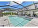 Large, screened-in pool and spa with ample seating and outdoor entertaining space at 7135 Graybrook Dr, Wesley Chapel, FL 33545