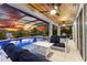 Evening view of a screened-in pool and spa with seating area at 7135 Graybrook Dr, Wesley Chapel, FL 33545